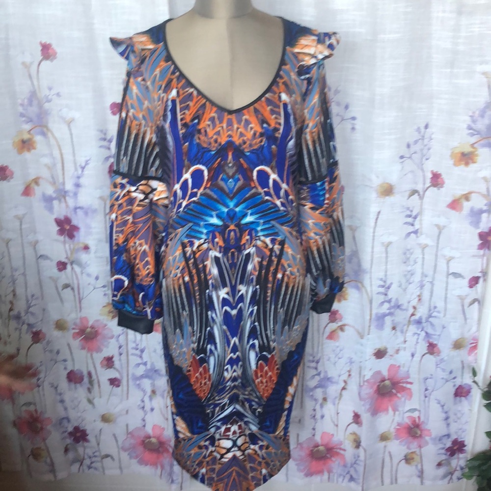 Bold prints and body conscious cap sleeves and faux leather trim